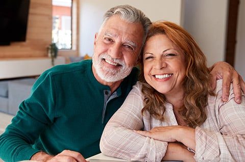 Smiling couple — full mouth reconstruction